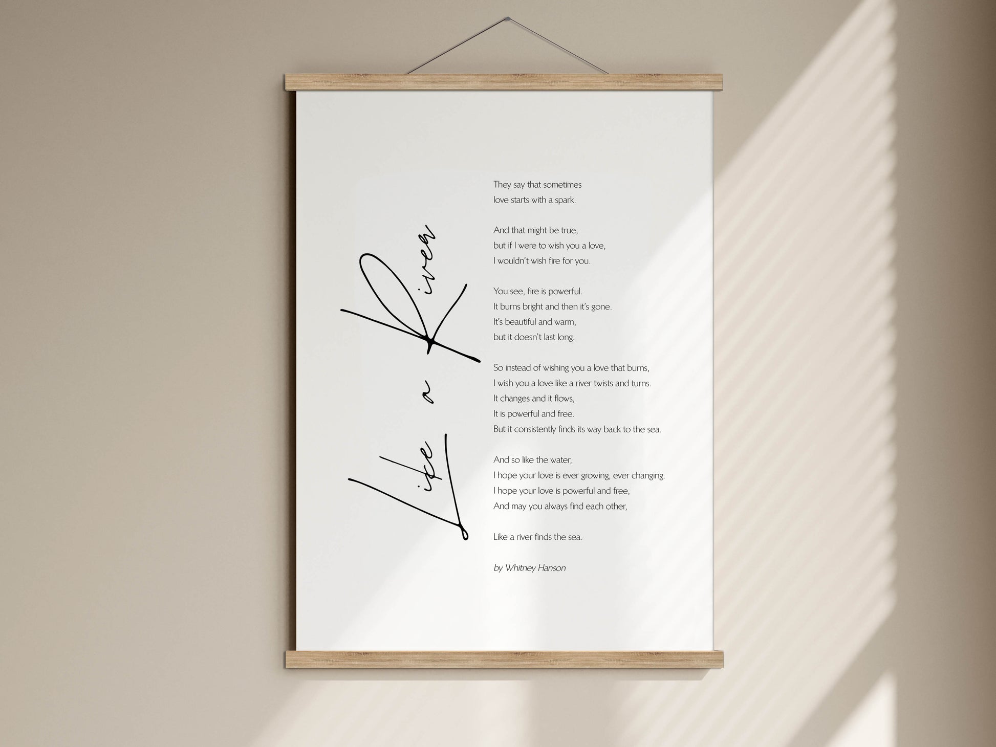 a white poster with a black cursive title and a poem written in black ink. The poster is hanging on a wall, and the text is arranged in a vertical format.