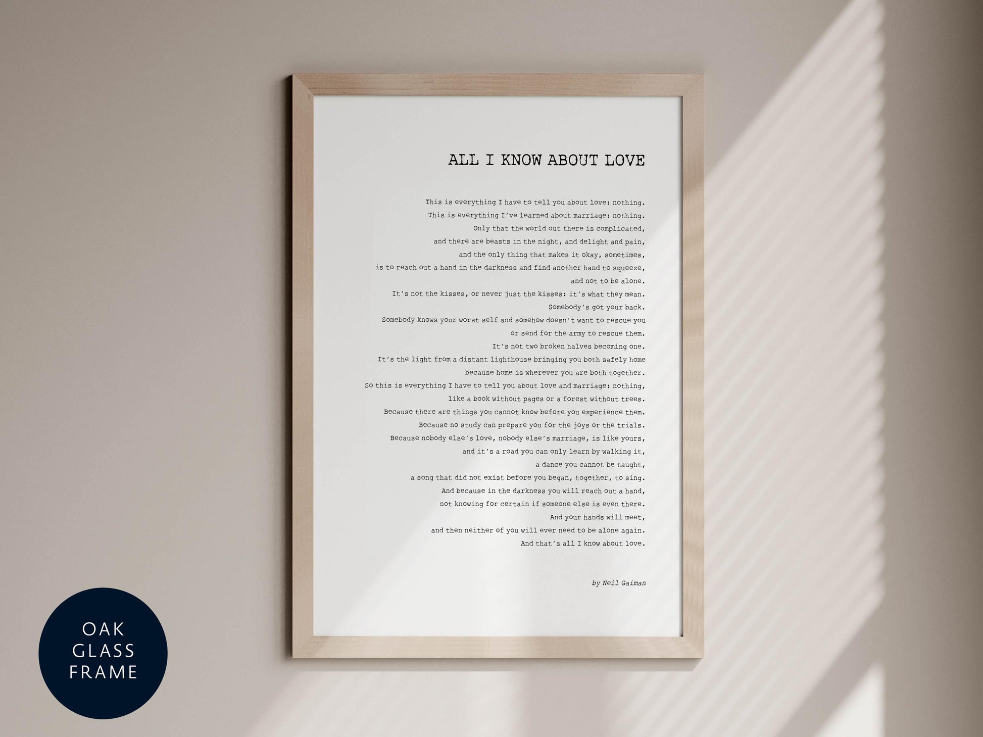 a framed poem titled "All I Know About Love" by Willi Gänter, which is displayed on a wall.