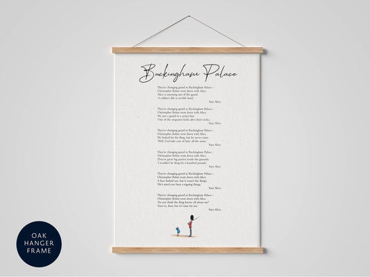 The image is a framed print of a poem titled "Buckingham Palace" with a wooden hanger frame. The text is in black cursive font and is displayed on a white background.