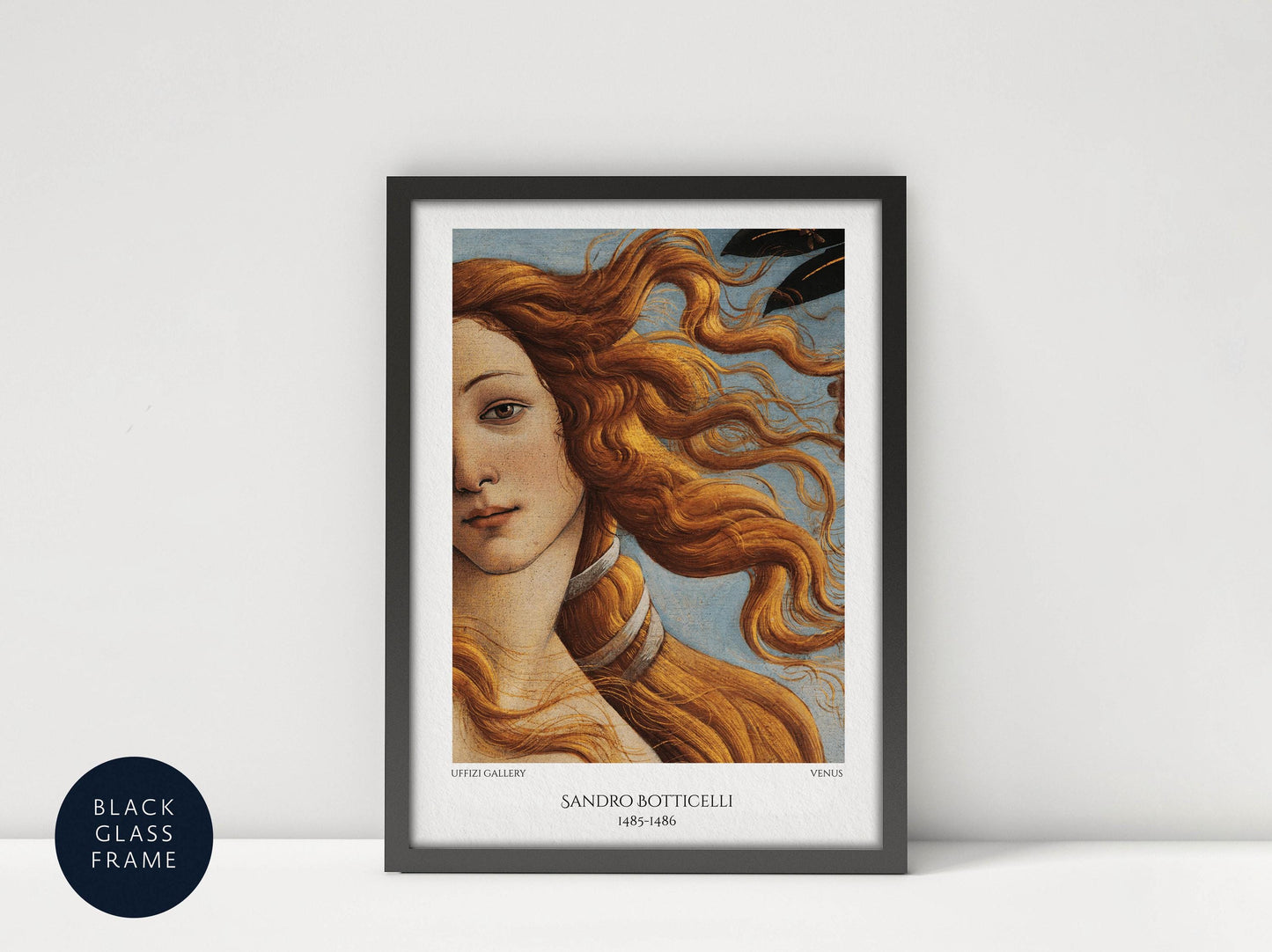 The image is a framed painting of a woman with flowing red hair, depicting the famous painting "The Birth of Venus" by Sandro Botticelli.