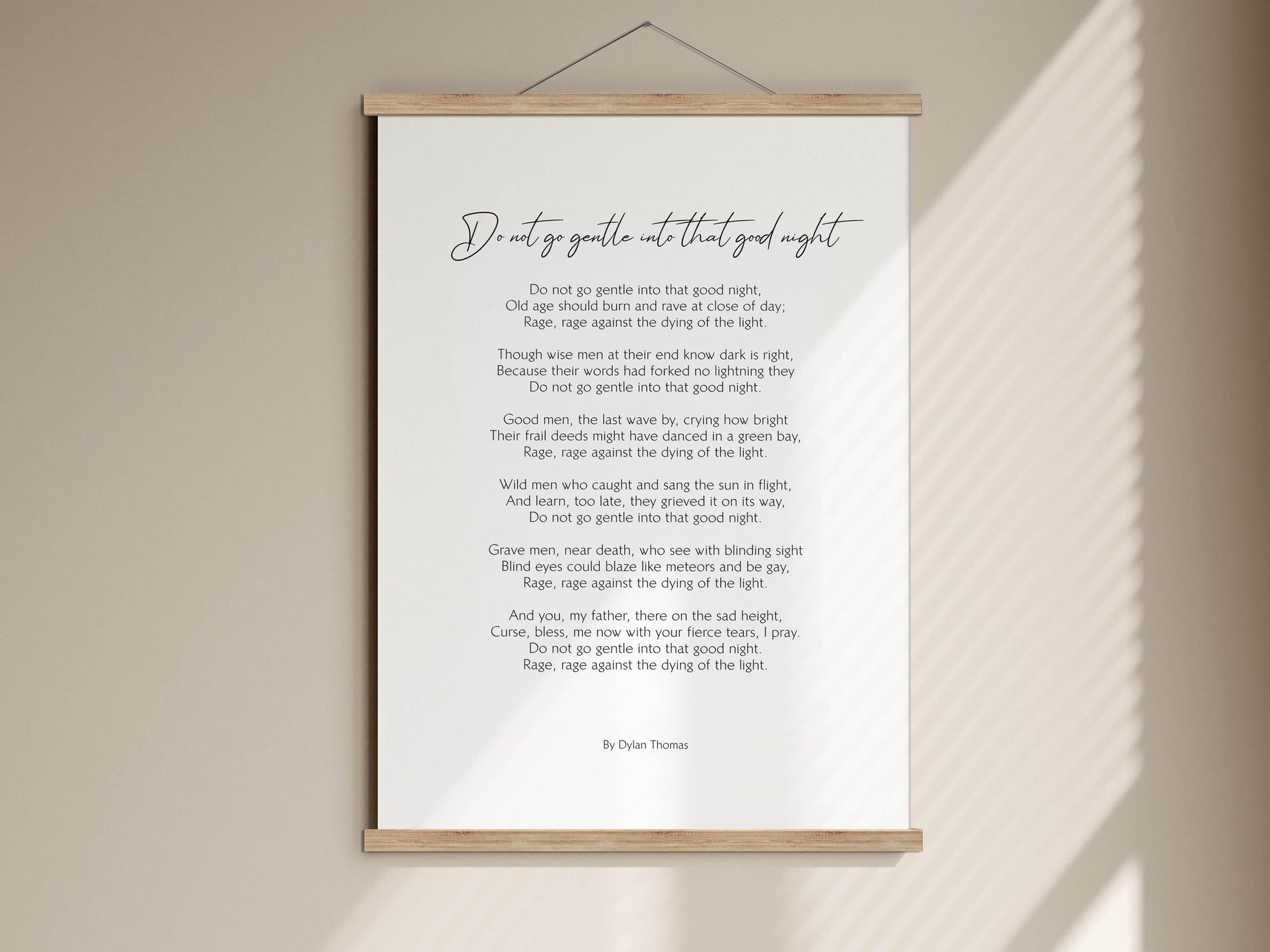 a poem titled "Do not go gentle into that good night" by Dylan Thomas. The poem is written in a cursive font and is framed by a wooden border. The text is displayed in a white background, and the poem is framed by a wooden border.