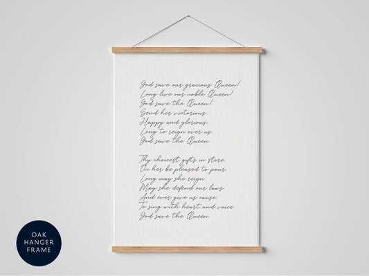 a framed print of a handwritten poem titled "Save Our Queen" hanging on a wall.
