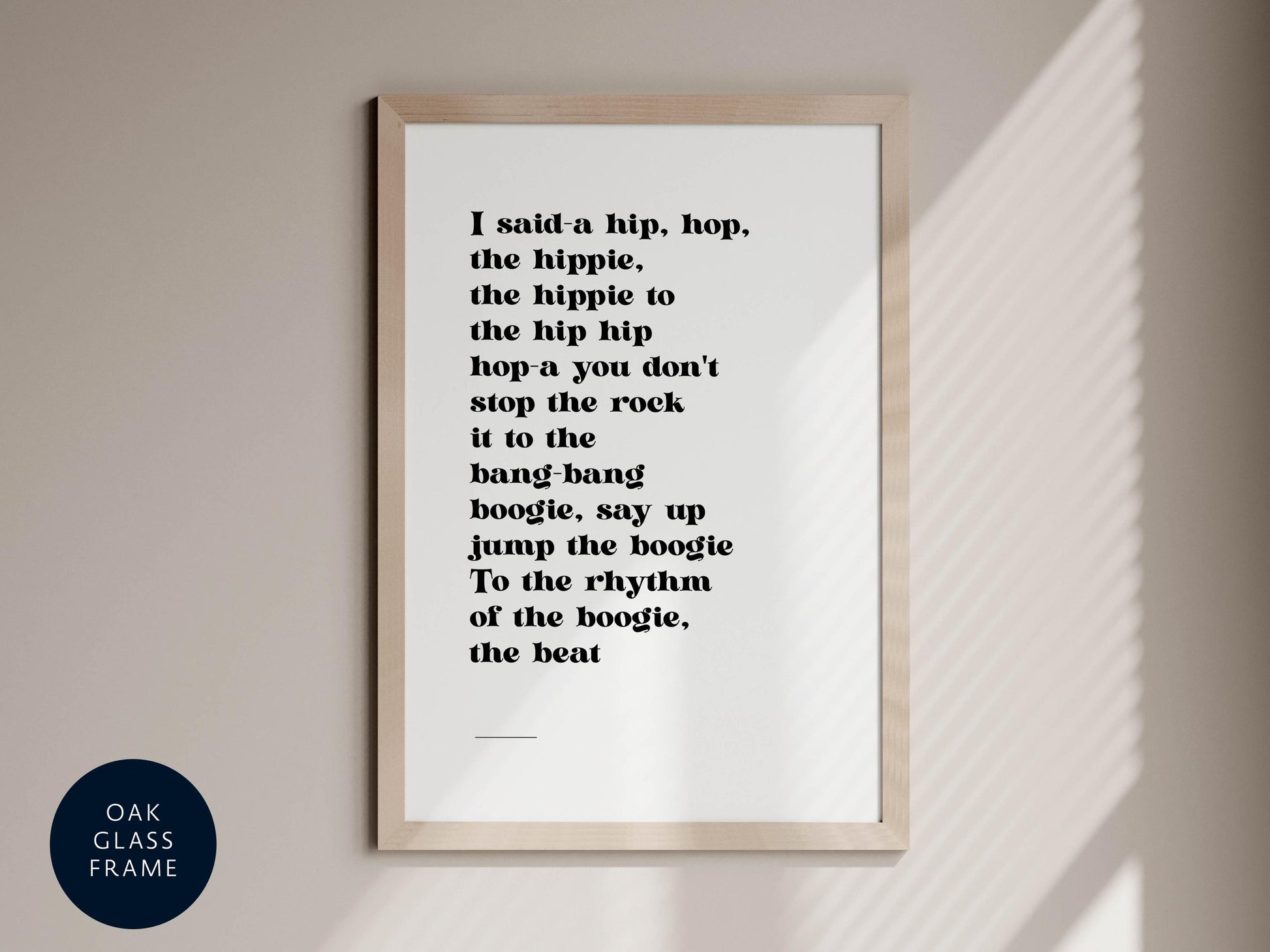 a framed quote with a hip-hop-inspired text, hanging on a wall.
