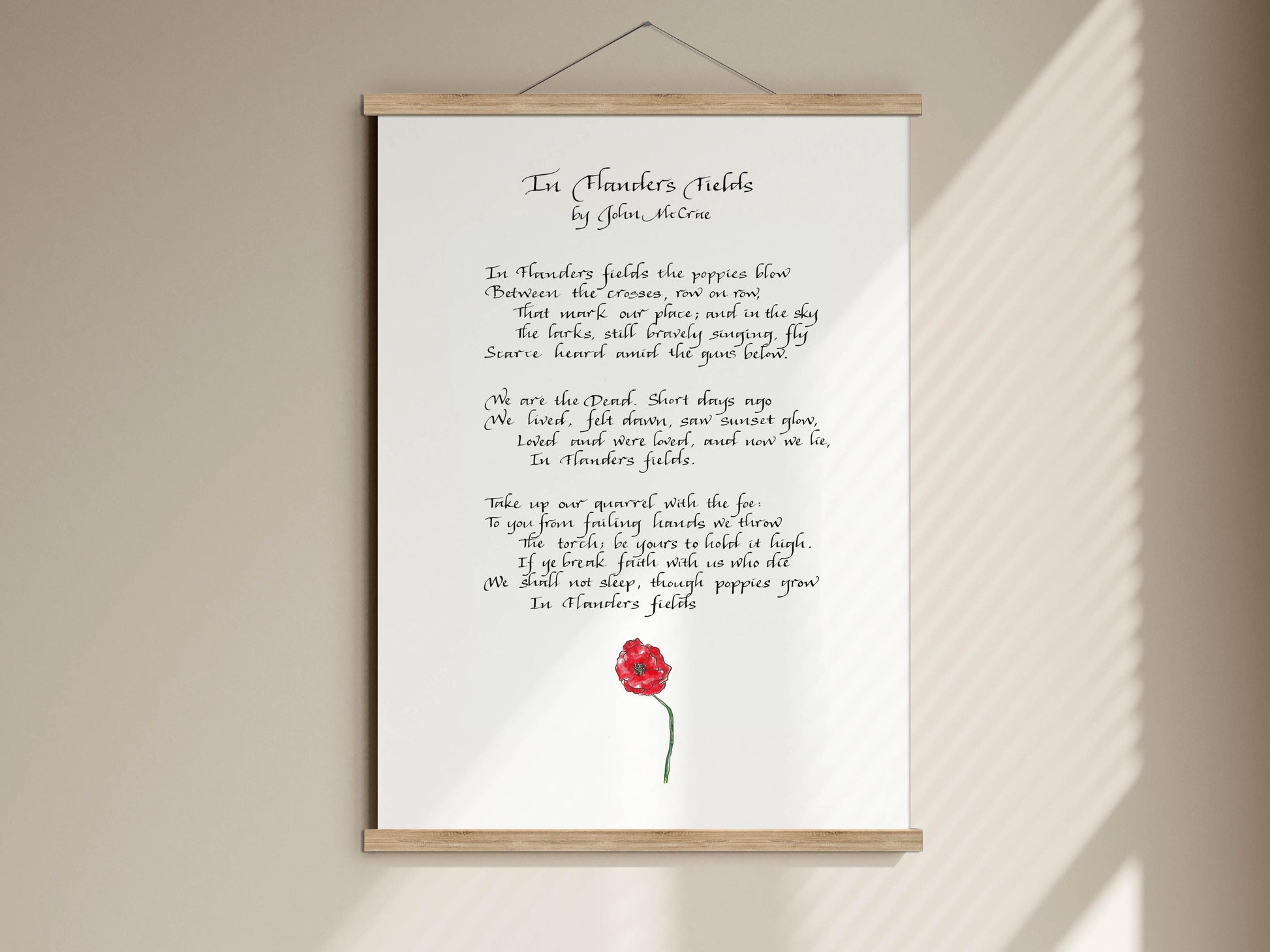 a framed poem titled "In thorns fields" by John Mcrae. The poem is written in English and features a red rose as a decorative element.