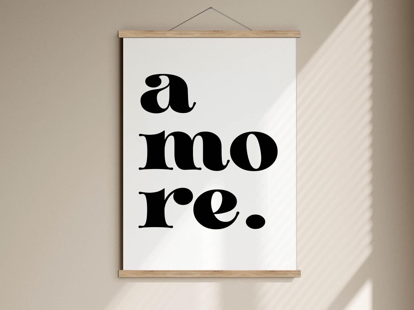 A white poster with the text "a more" in bold black letters.