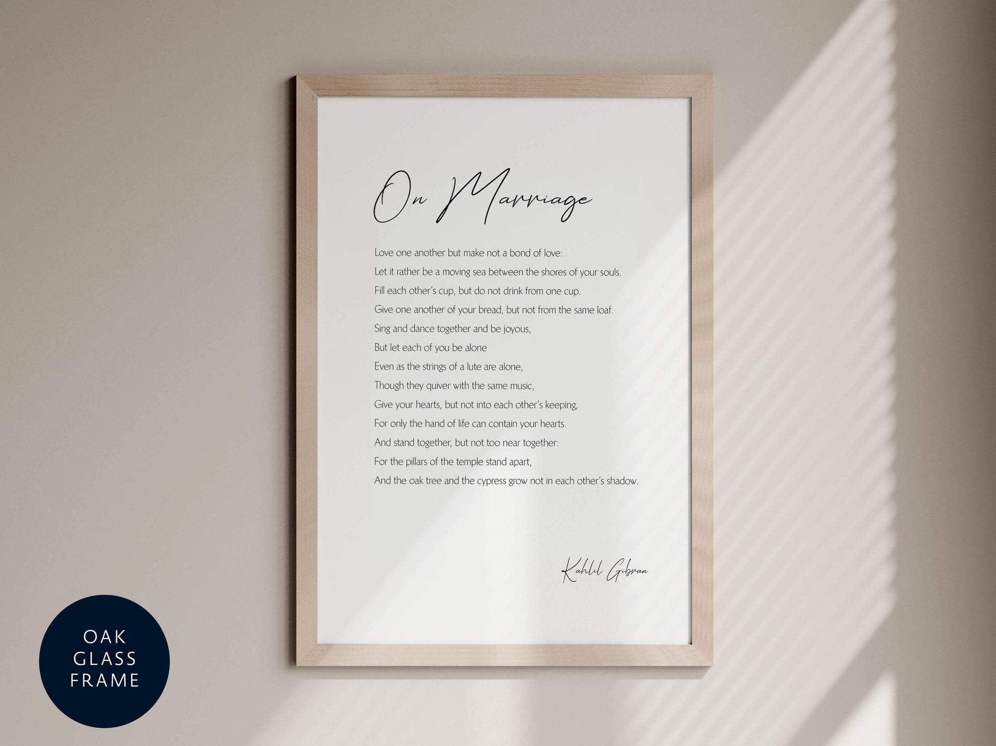 a framed poem titled "On Marriage" by Kahlil Gibran, which is displayed on a wall.