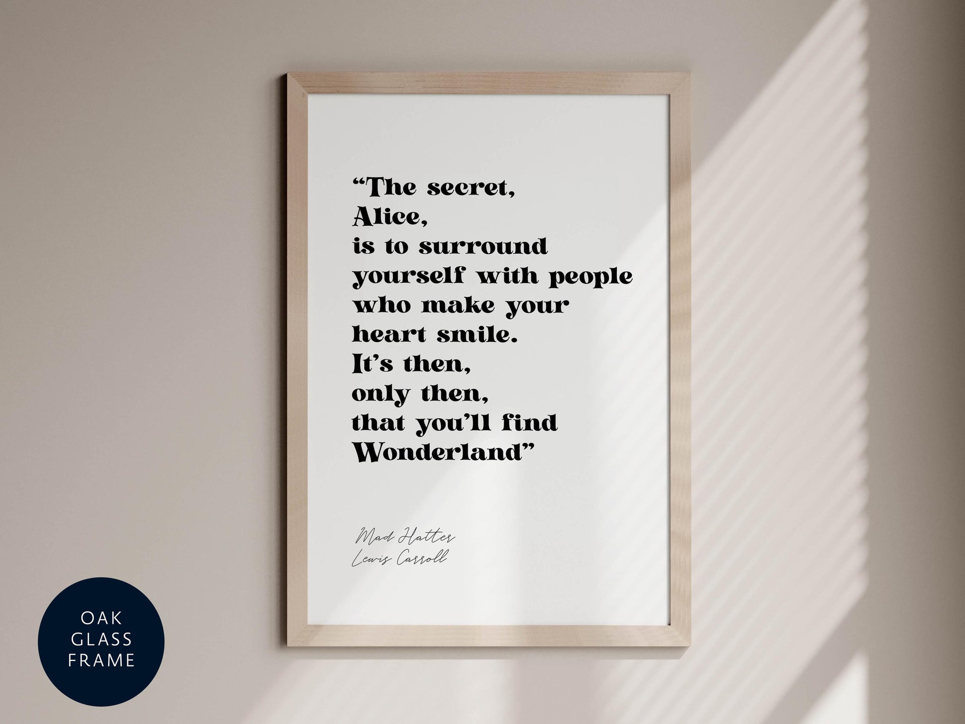 a framed quote by Mad Hatters, Louis Cassill, that reads: "The secret, Alice, is to surround yourself with people who make your heart smile. It's then, only then, that you'll find Wonderland."