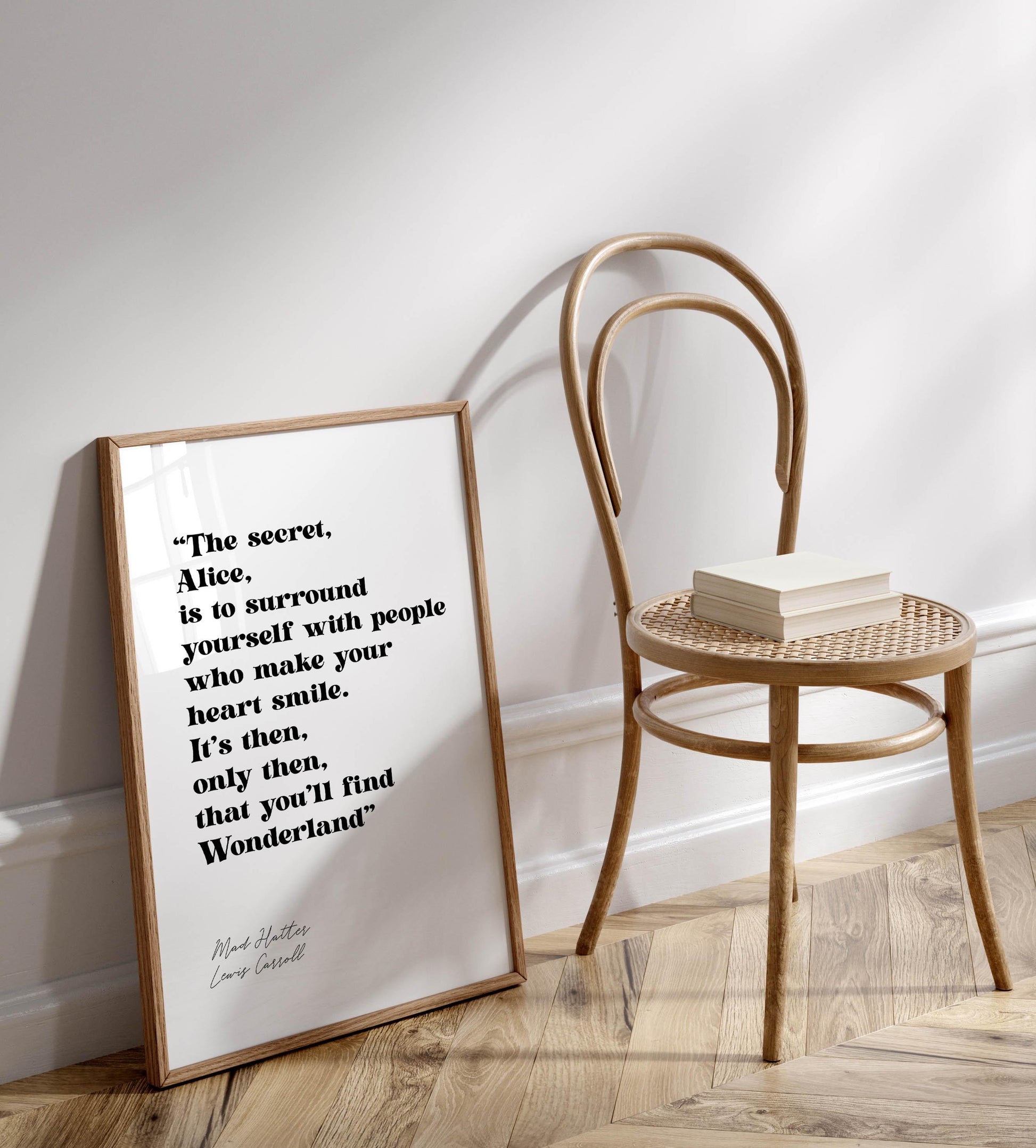 a framed quote by Mad Hatcher, "The secret, Alice, is to surround yourself with people who make your heart smile. It's then, only you'll find Wonderland."