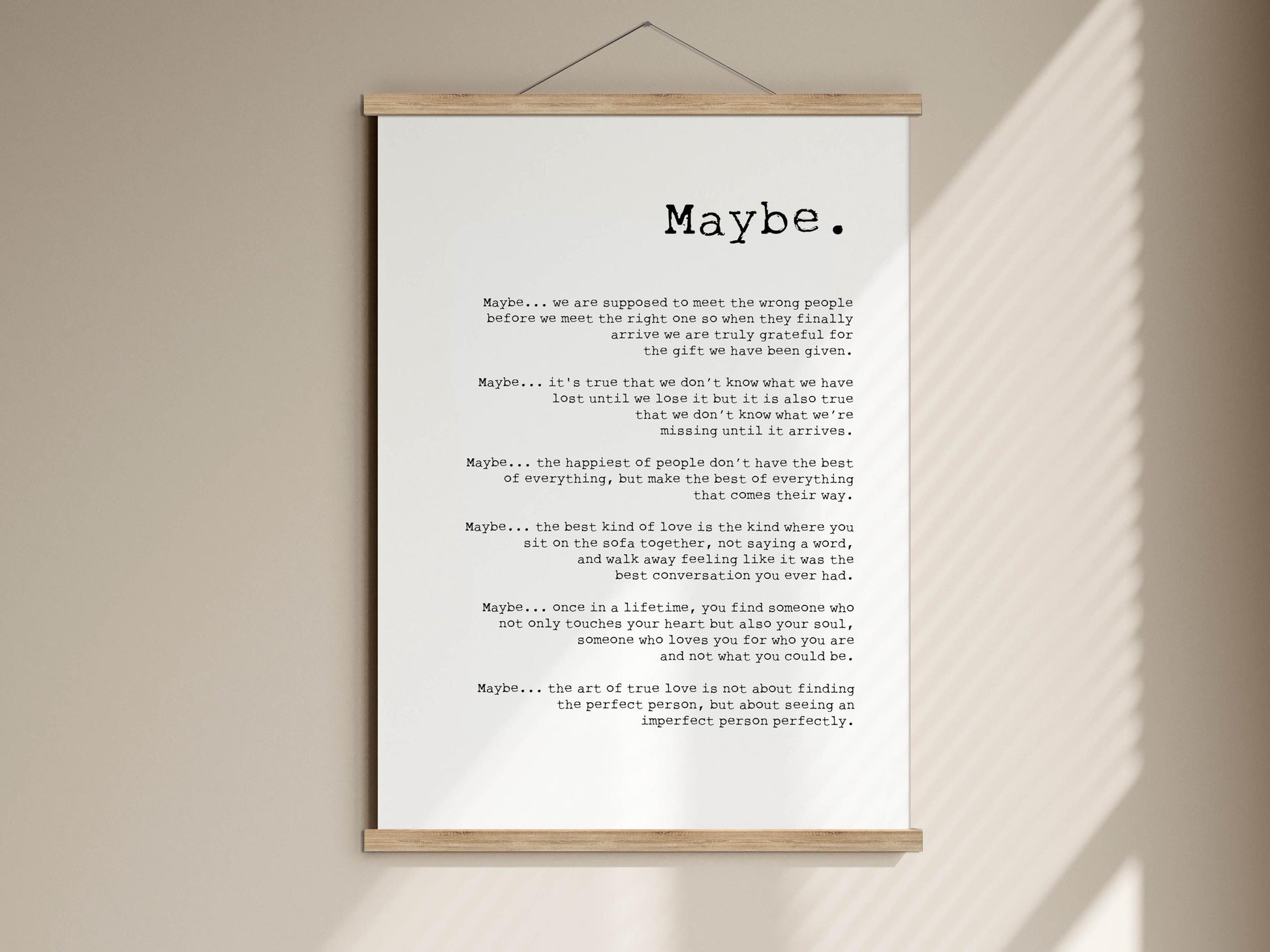 a text that is a poem or a message, with a wooden frame around it. The text is written in black ink on a white background.