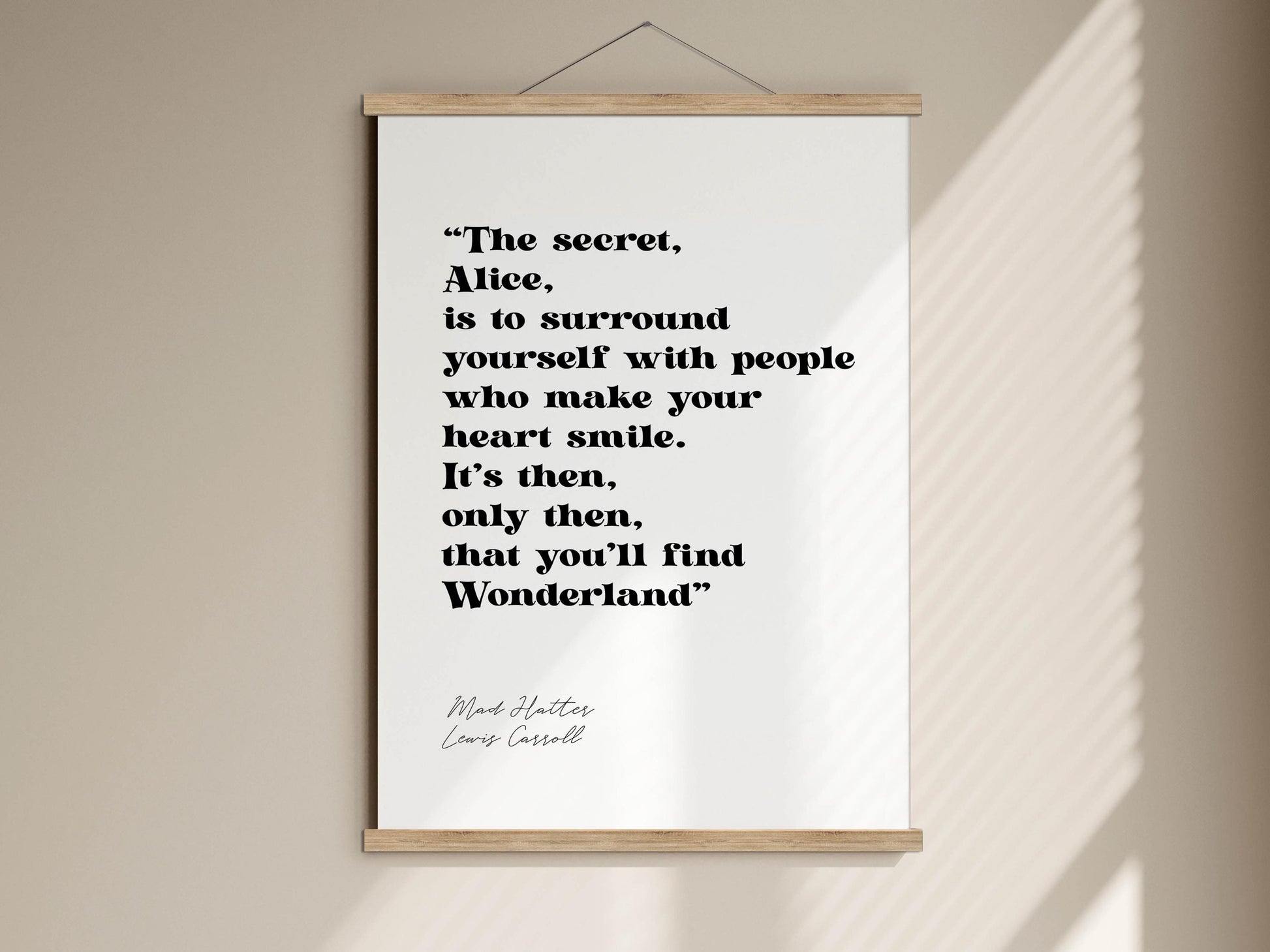 a quote from the book "Alice in Wonderland" by Lewis Carroll, which reads: "The secret, Alice, is to surround yourself with people who make your heart smile. It's then, only then, that you'll find Wonderland".