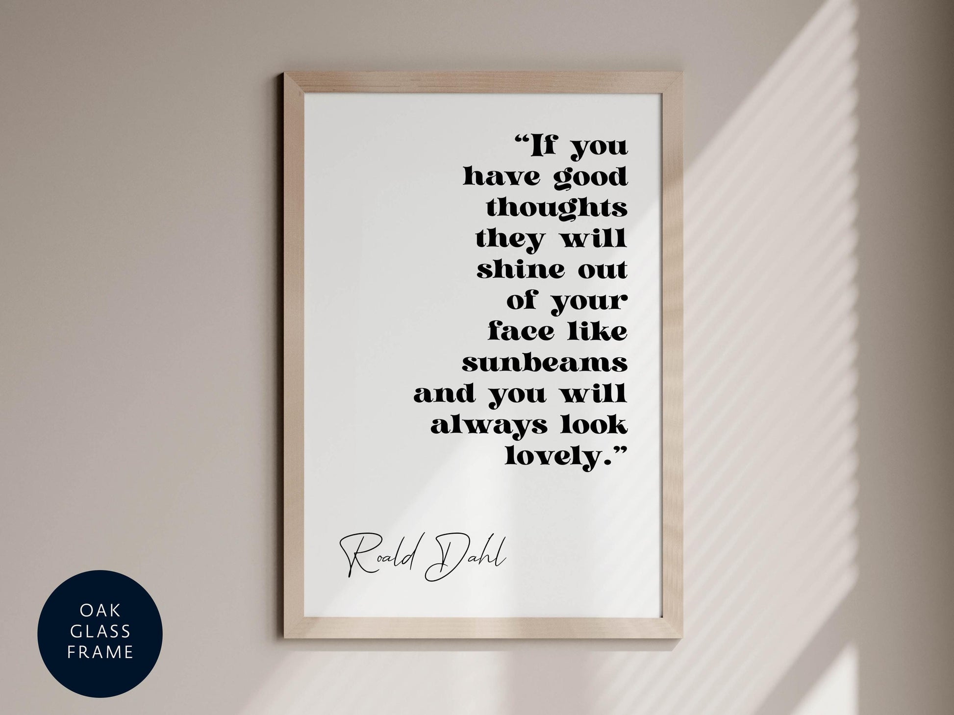 a quote by Roald Dahl, which reads: "If you have good thoughts they will shine out of your face like sunbeams and you will always look lovely." The quote is presented in a framed format, hanging on a wall.