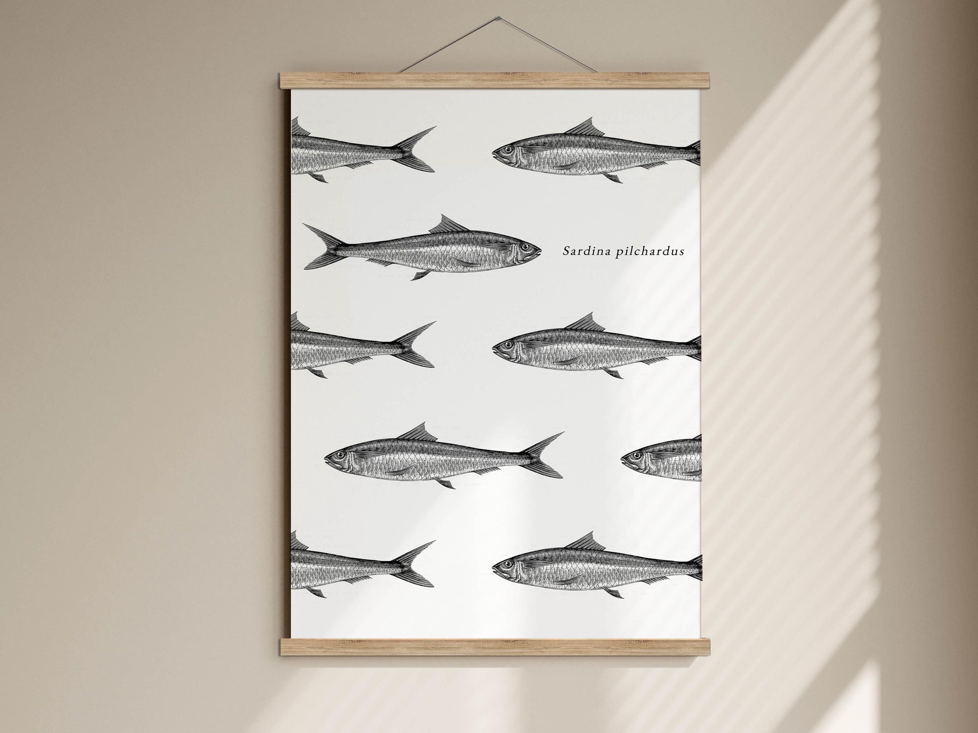 The image is a framed print featuring a repeating pattern of fish illustrations on a white background.