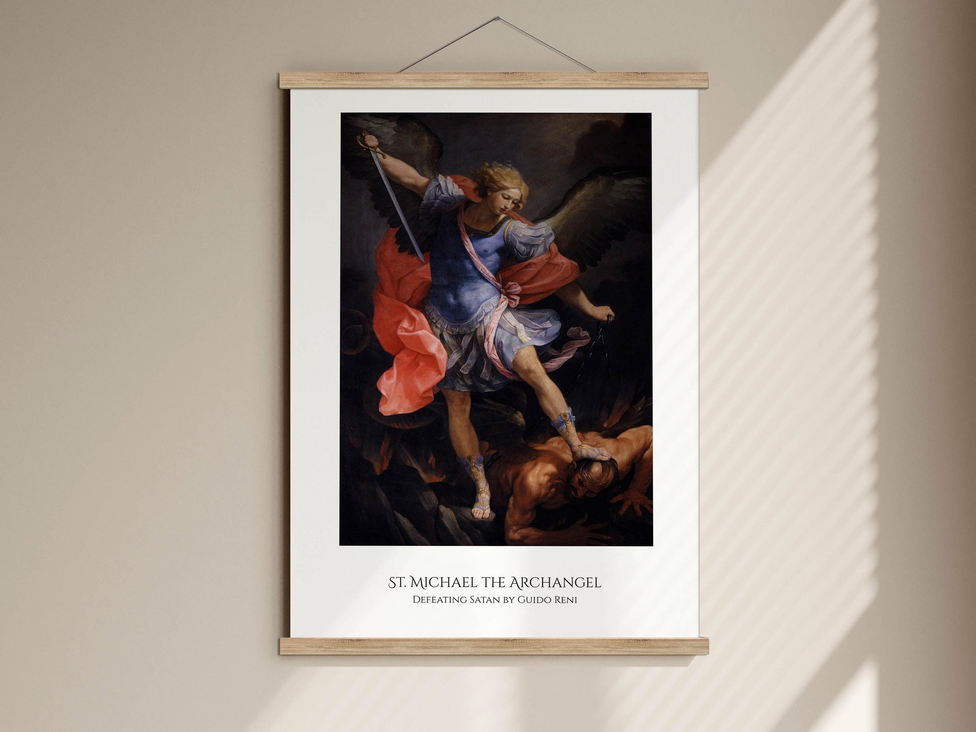 The image is a framed painting of St. Michael, the archangel, standing on a pedestal and holding a sword, with a winged figure below him.