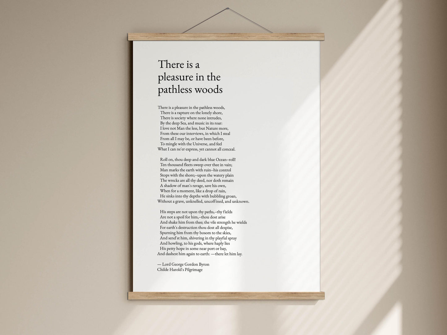 The image is a poster with a poem titled "There is a pleasure in the pathless woods" by Lord George Gilbert Byron.