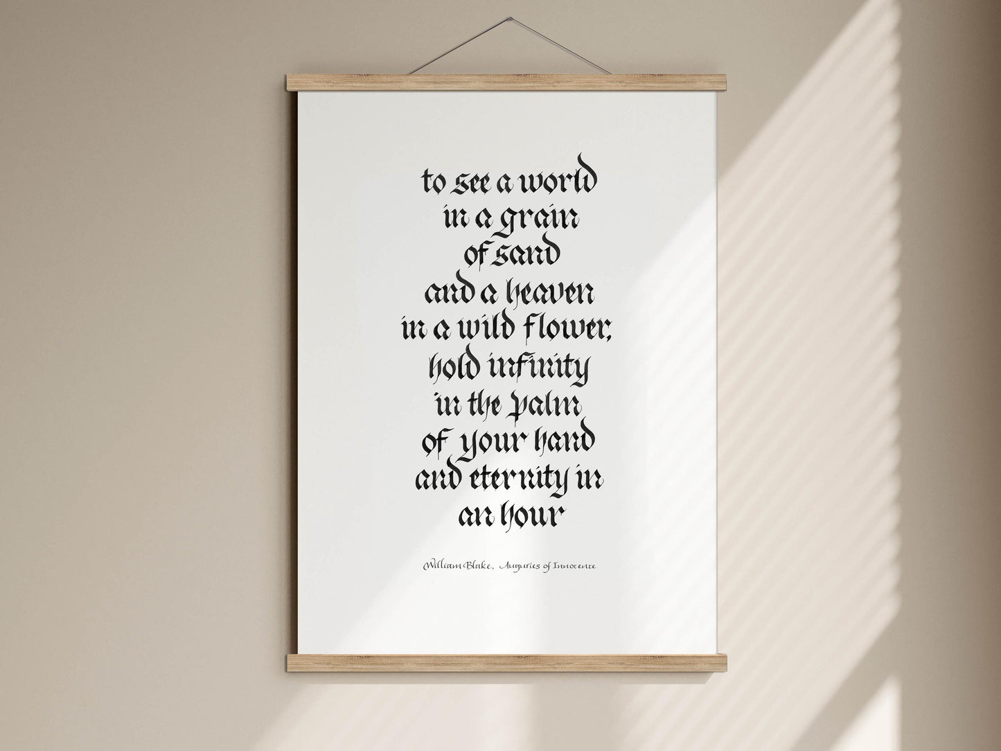 a quote in a foreign language, which is a quote by William Blake about seeing a world in a grain of sand and a leaf in a wild flower, holding infinity in the palm of your hand and eternity in an hour.