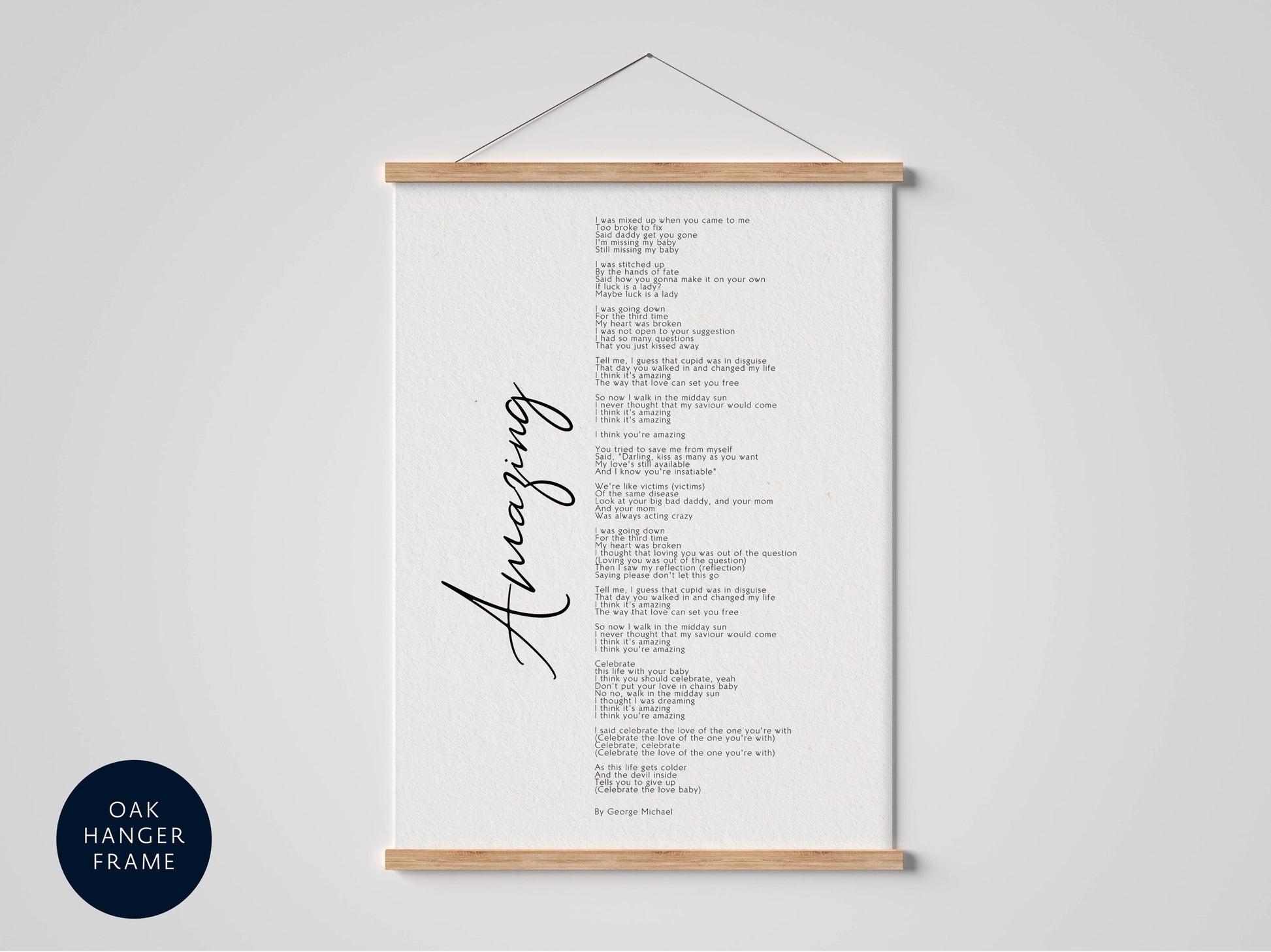 a white poster with black text, hanging on a wall. The poster appears to be a song or poem, with the word "Amazing" written in cursive at the bottom.