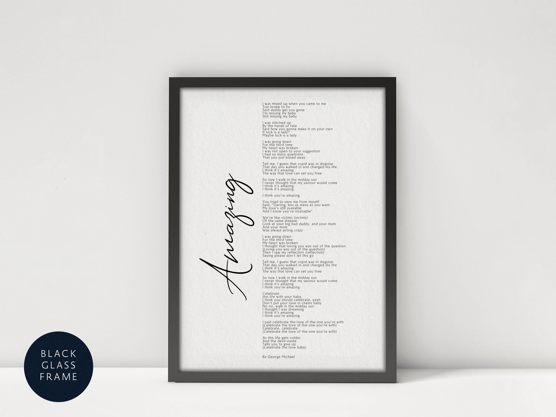 a framed black and white poster with a list of words written in cursive.
