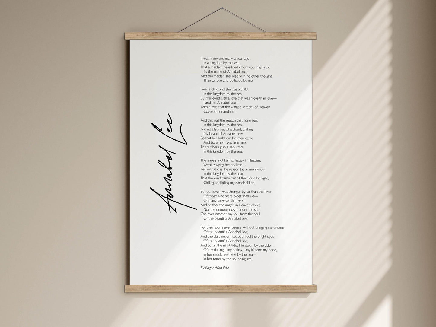 The image is a poster with a poem titled "Aubrey Lee" written in black ink. The poem is displayed on a wooden frame, and the background is white. The text is arranged in a column format, with the poem's content described in a few sentences.
