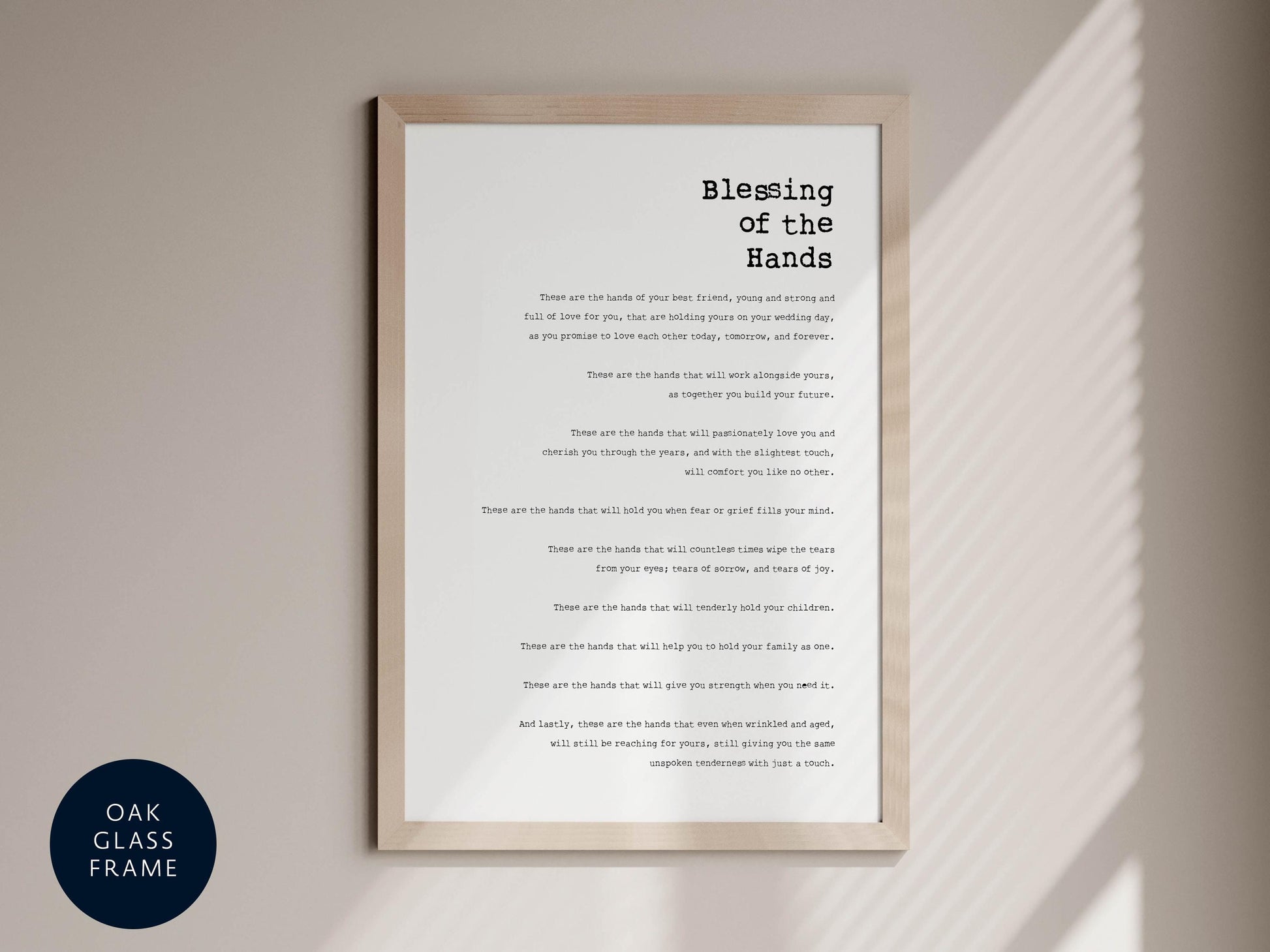 a framed text that reads "Blessing of the Hands" in a black and white color scheme.