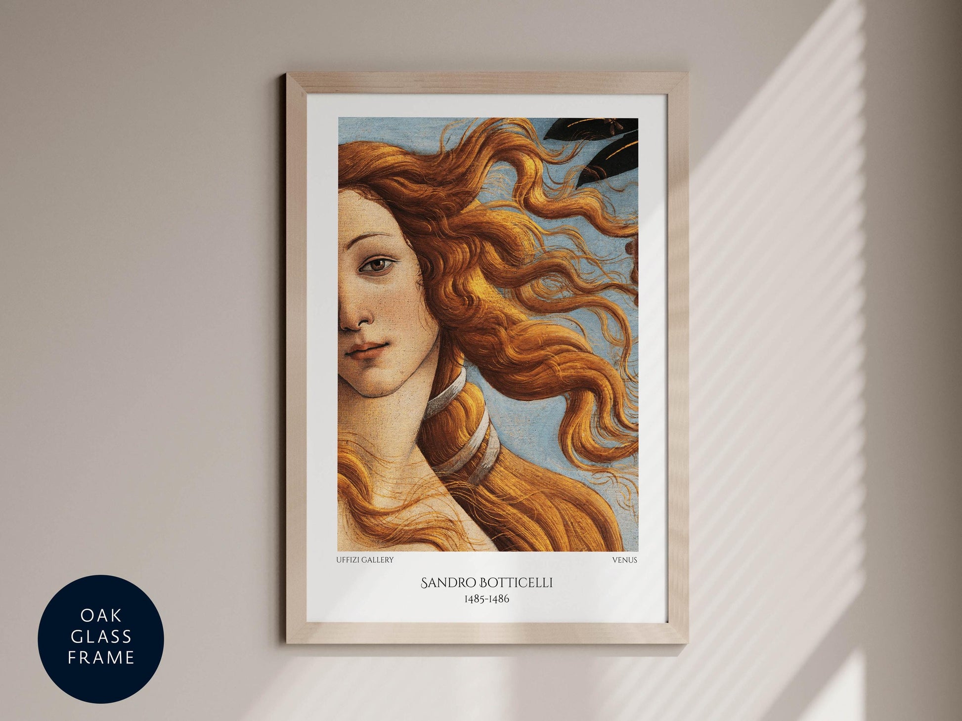 The image is a framed painting of a woman with flowing hair, depicting the famous painting "The Birth of Venus" by Sandro Botticelli.