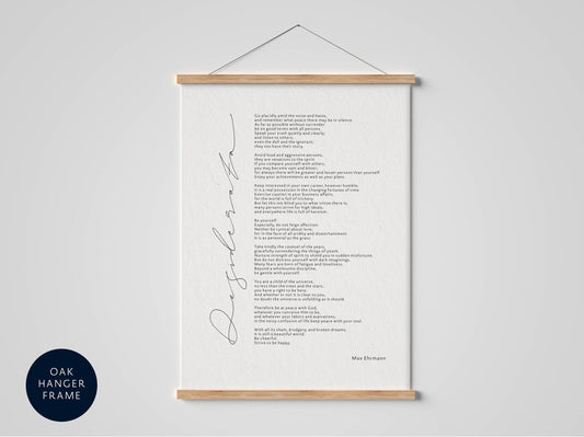 a framed poem titled "Despera" by Max Ehrmann, which is hanging on a wall.