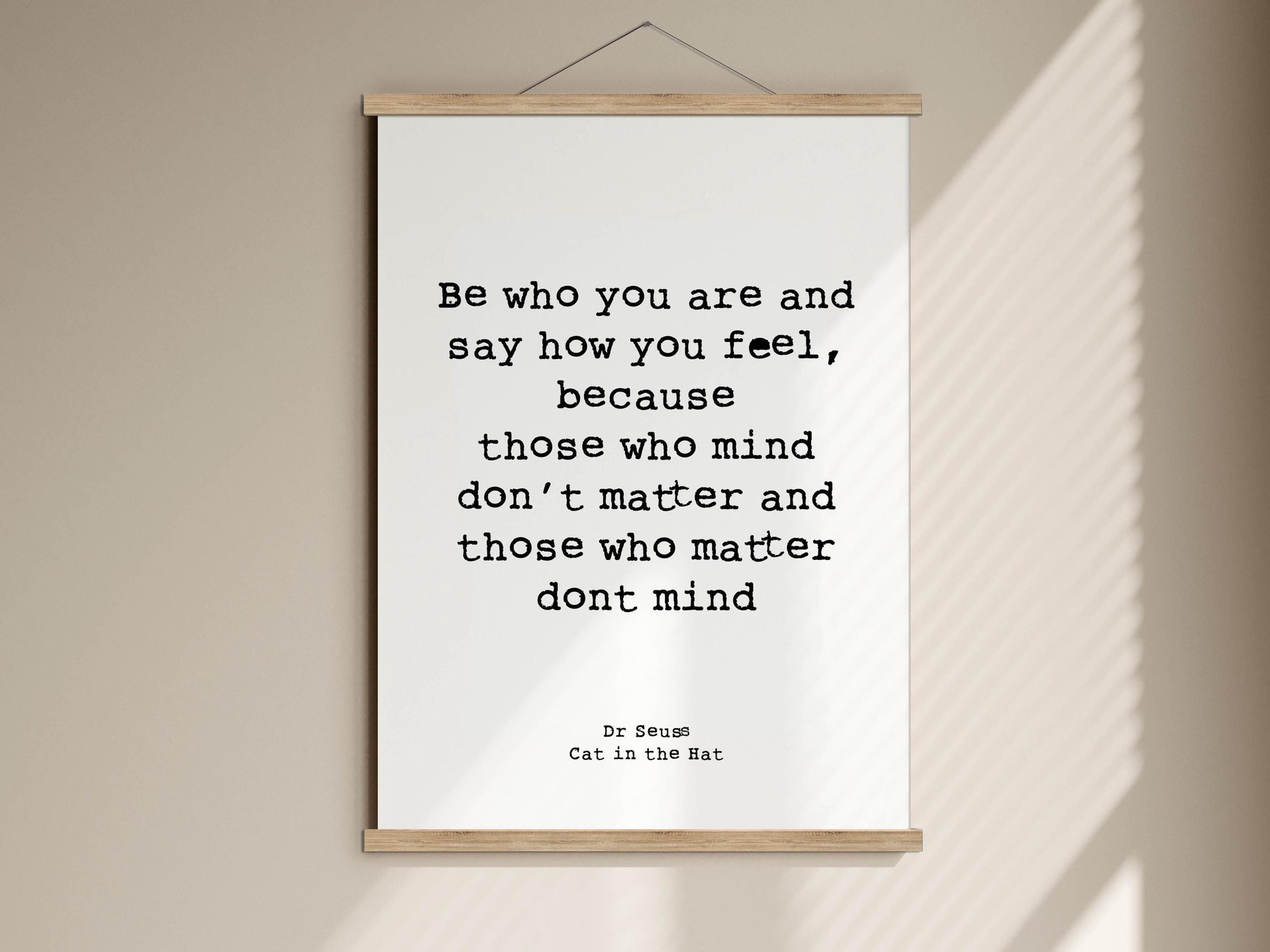 a quote from the book "Cat in the Hat" by Dr. Seuss, which reads: "Be who you are and say how you feel, because those who mind don't matter and those who matter don't mind."