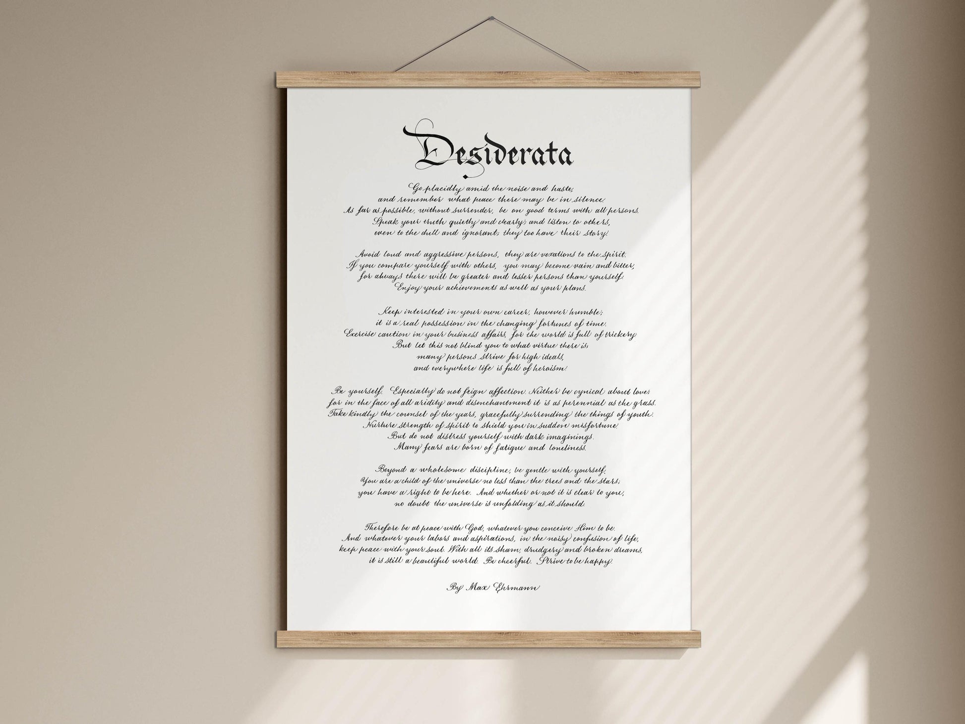a scroll-like artwork with a poem titled "Desiderata" written in a cursive script.