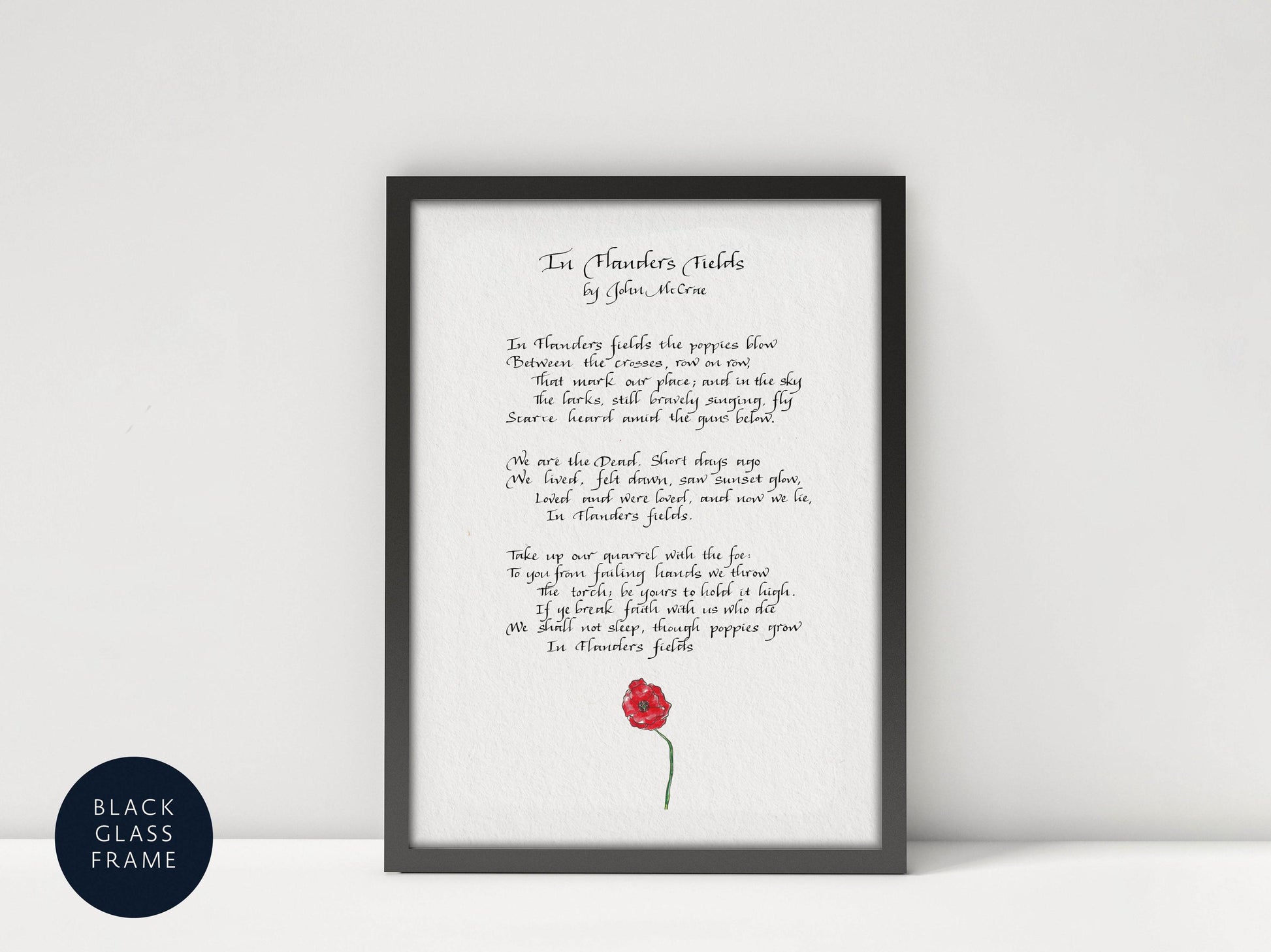 a framed poem titled "In Flowers Fields" by John McCrae.