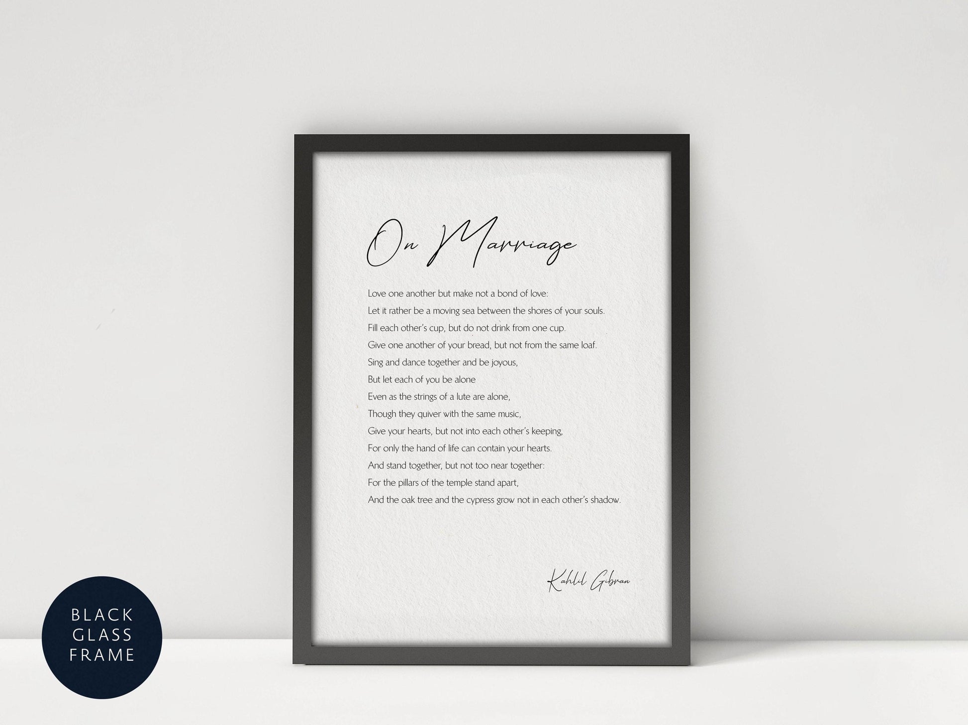 a framed poem titled "On Marriage" by Kahlil Gibran, which is a love poem about the beauty of marriage.