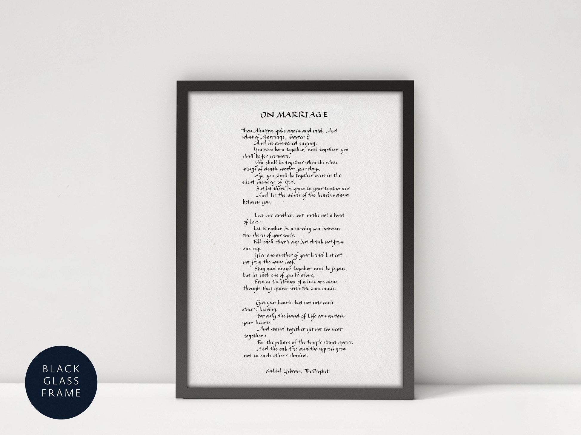 a framed black and white poem titled "ON MARRIAGE" by Kahlil Gibran, the Prophet.