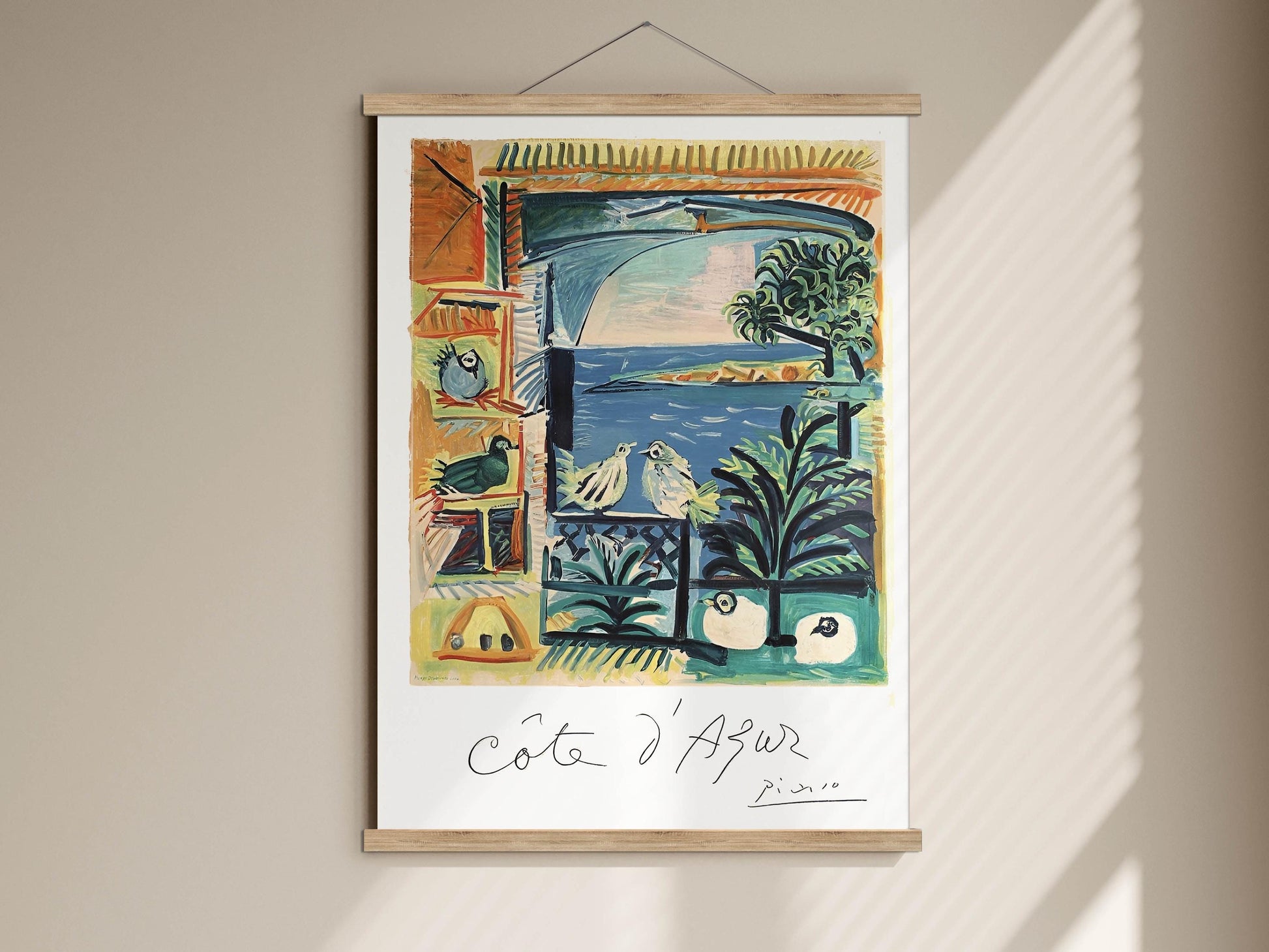 The image is a framed painting hanging on a wall, depicting a colorful and vibrant scene with various elements such as birds, plants, and a body of water.