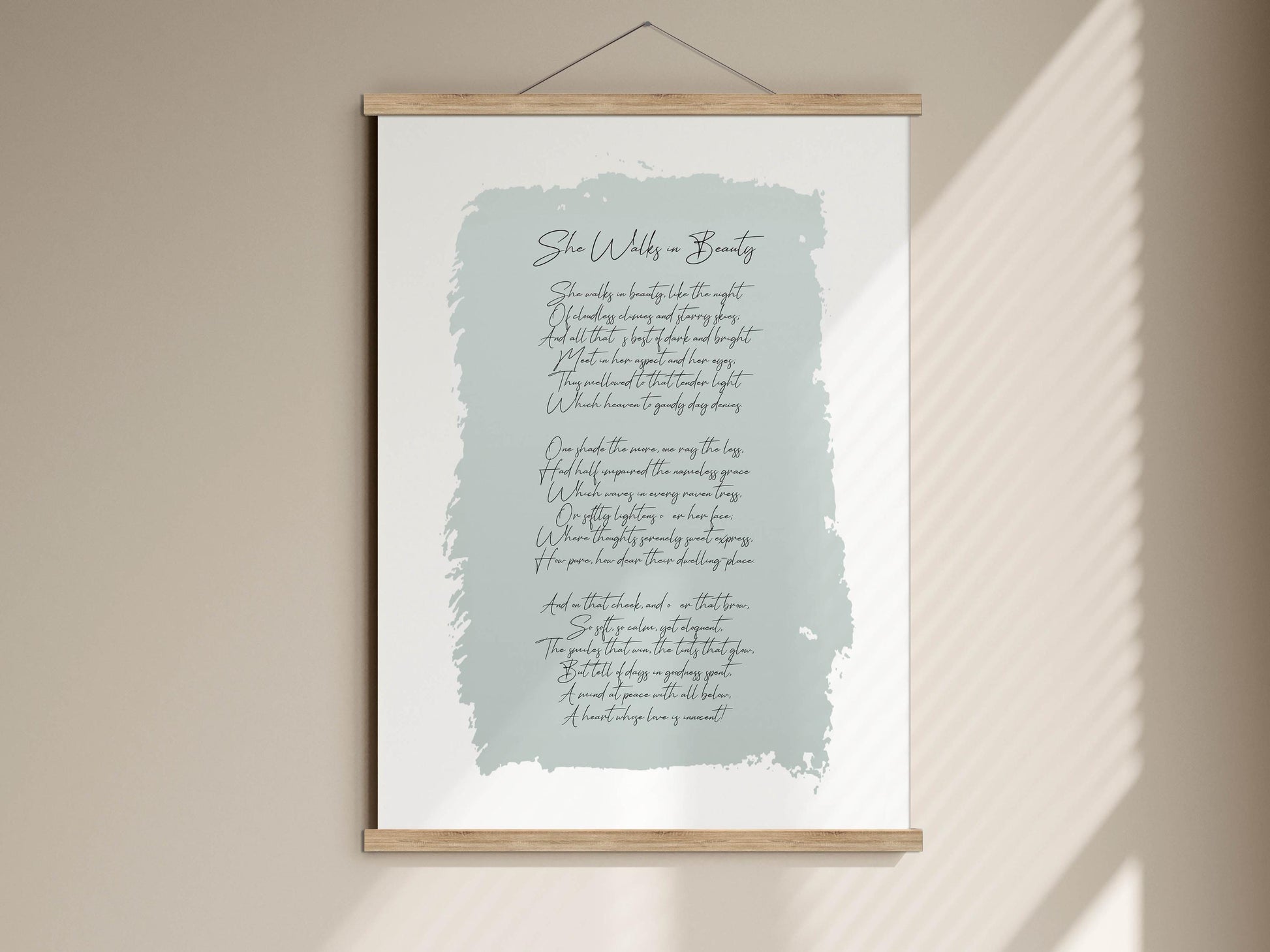 A framed print with a light blue background and cursive text, titled "She walks in beauty".