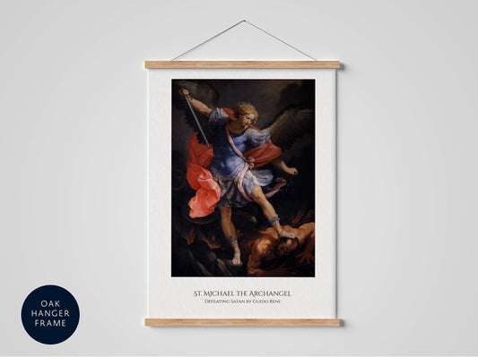 The image is a framed painting of St. Michael the Archangel, depicted in a dramatic pose with wings and a sword, standing over a fallen figure.