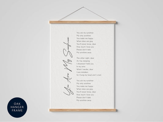 a framed print with a poem titled "You are my sunshine" written in a cursive font. The poem is about the speaker's love for their sunshine and how it brings happiness and comfort to their life.