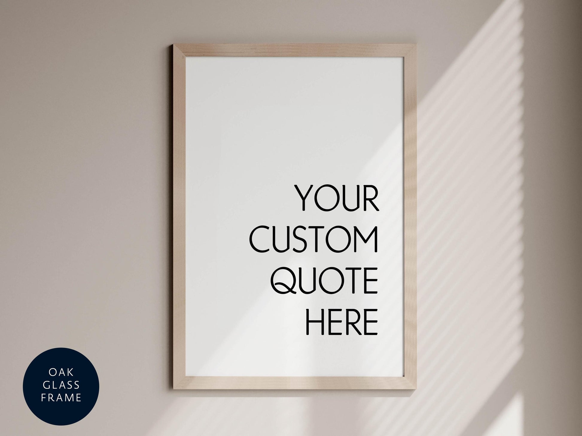 a white framed poster with the text "YOUR CUSTOM QUOTE HERE" written in black.