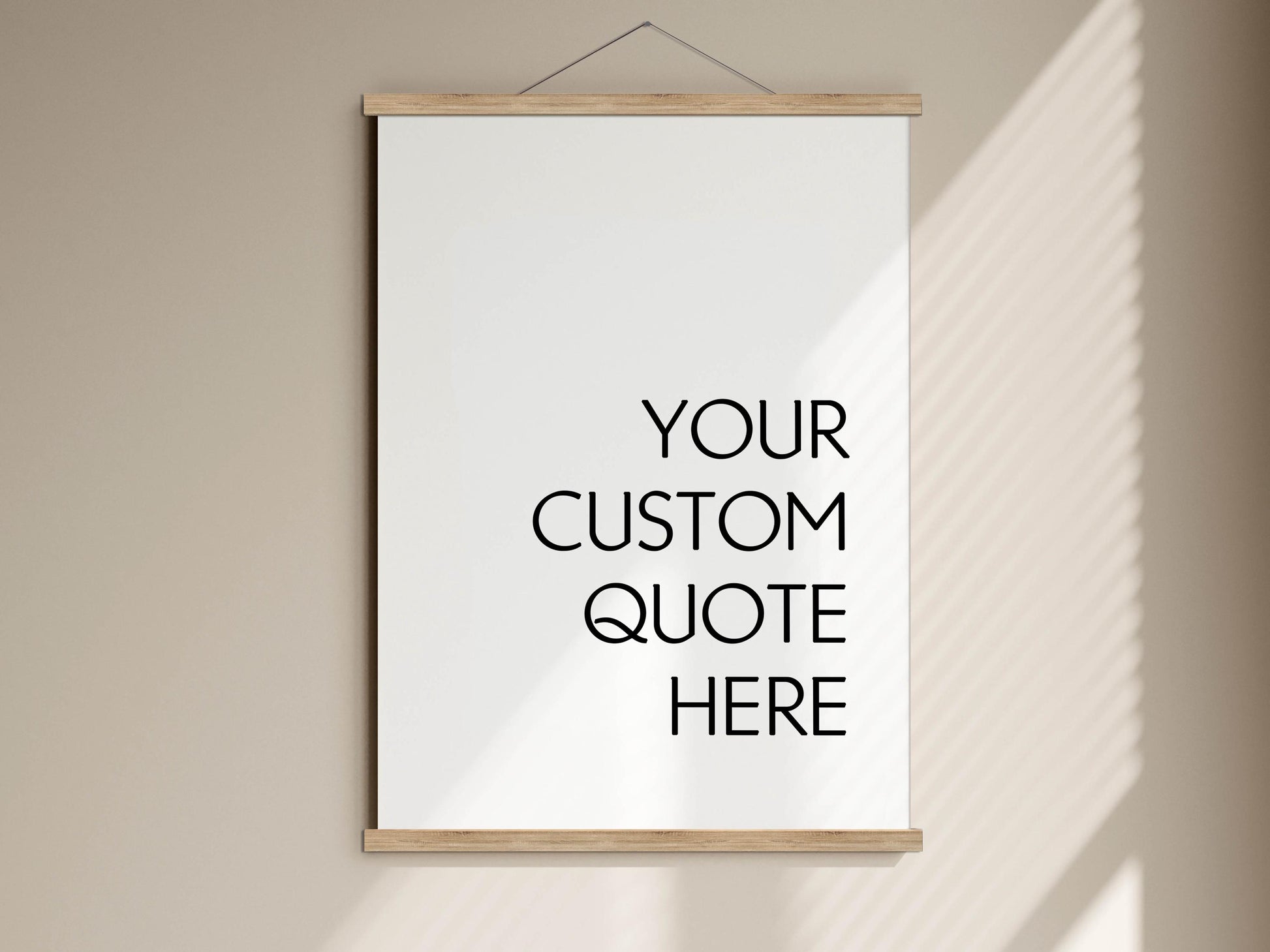 A white poster with the text "YOUR CUSTOM QUOTE HERE" written on it, hanging on a wall.