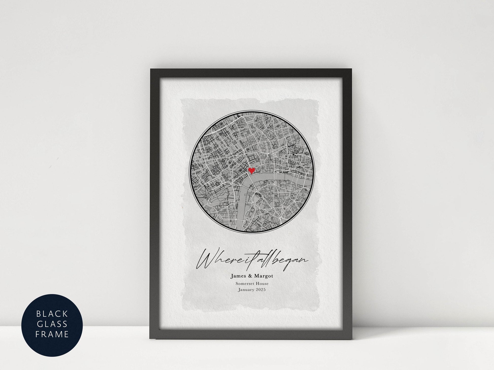 A framed print depicting a map of London with a red heart symbol, accompanied by the names 'James & Margarita' and the date 'January 2013'.