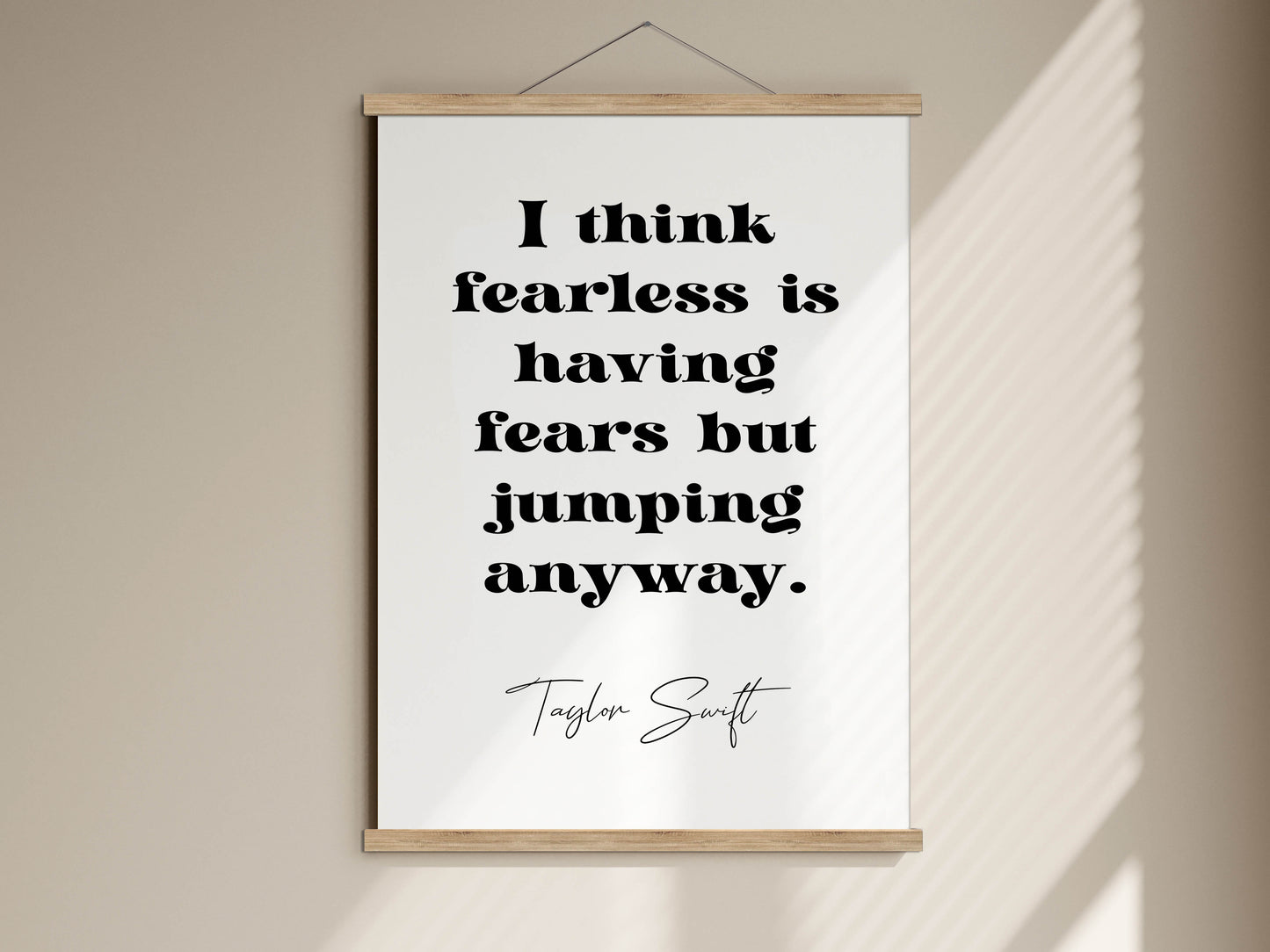 Taylor Swift quote - I think fearless is having fears but jumping anyway framed print