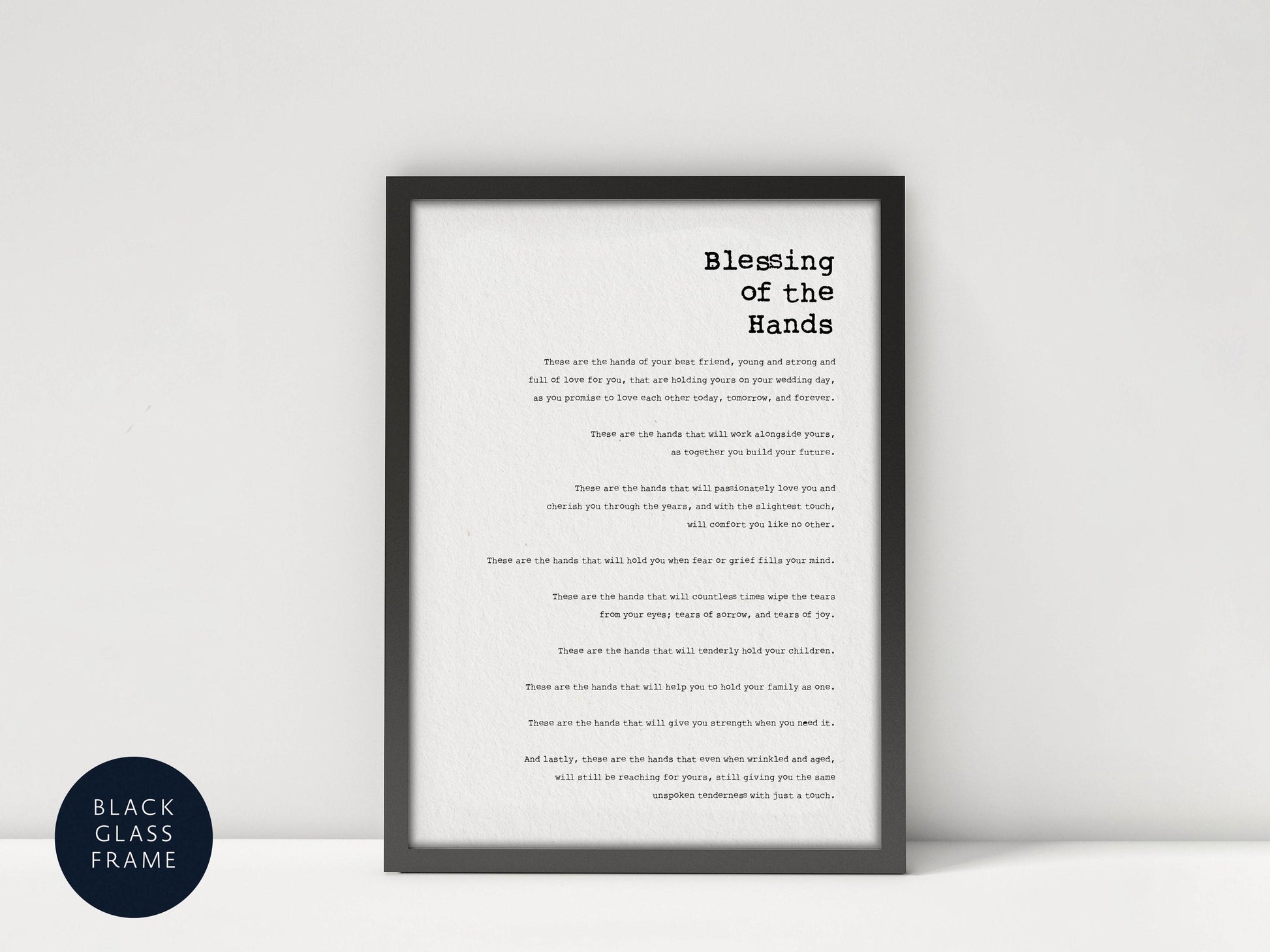 a black and white framed text that reads &quot;Blessing of the Hands&quot; in a simple, elegant font.