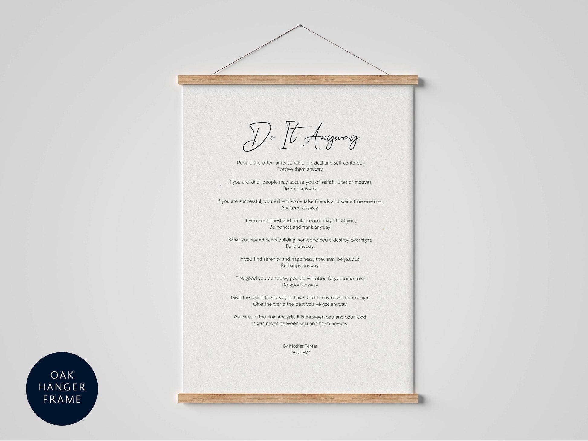 a framed print of a poem titled &quot;Do it anyway&quot; hanging on a wall.