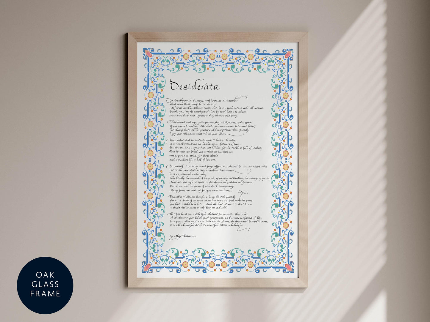 a framed print with a decorative border and ornate lettering, which appears to be a poem or a religious text.