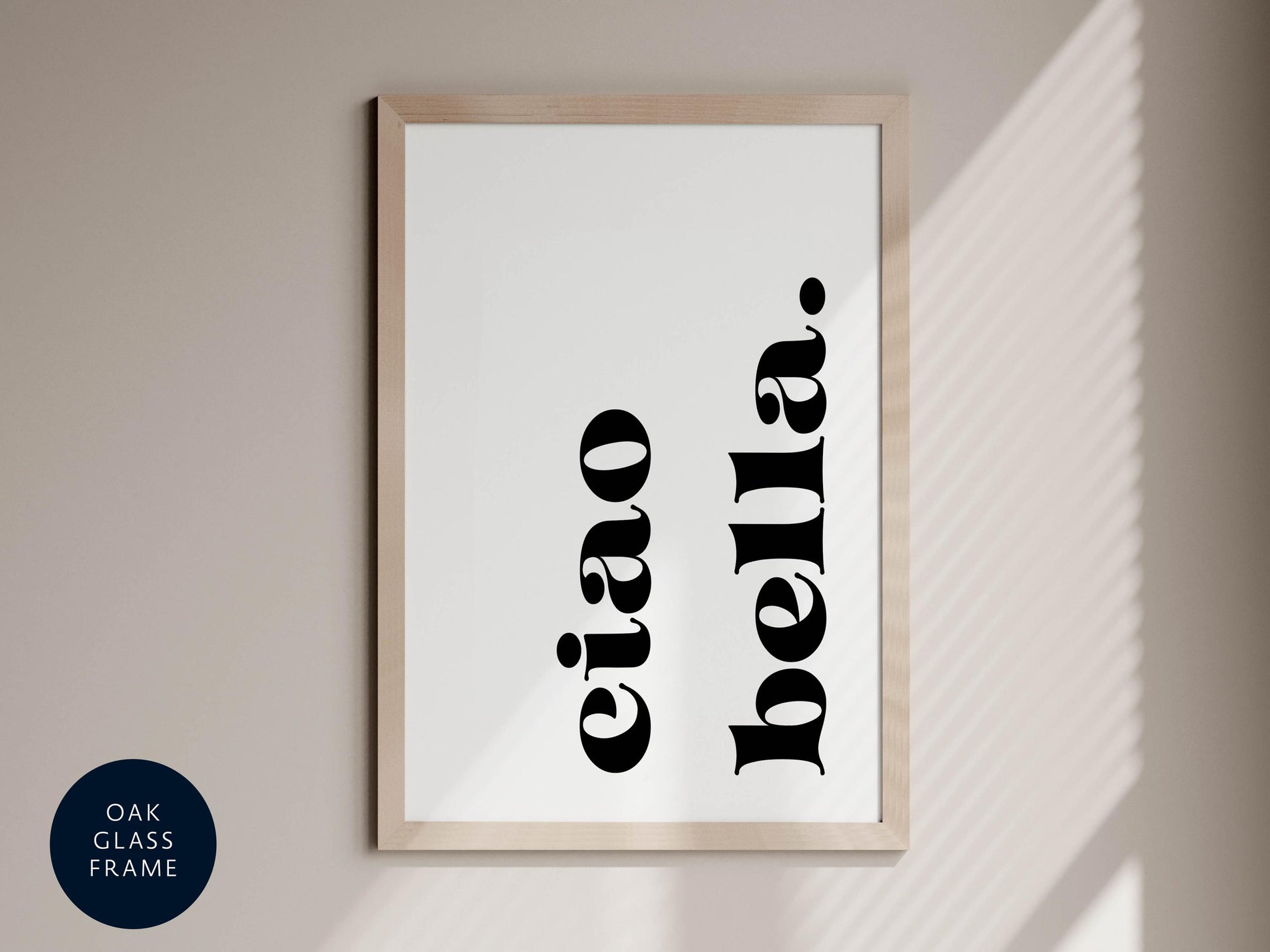 a framed print with the text &quot;eiao bella&quot; in a minimalist black font against a white background.