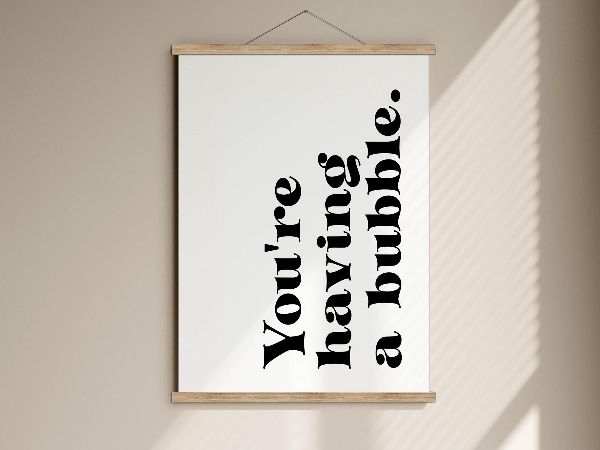 A framed poster with the text &quot;You&#39;re having a bubble&quot; displayed on it.