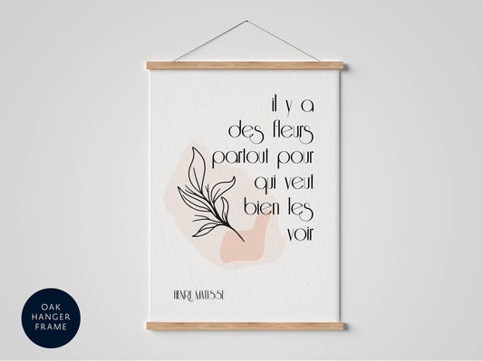 a poster with a quote by Henri Matisse, which reads &quot;It y a des flères portoles pour que vieux biennes les voir&quot;.
