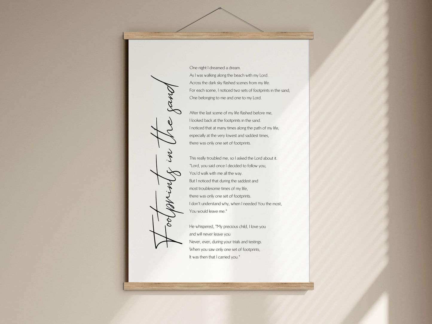 The image is a poster with a poem titled &quot;Footprints in the sand&quot; written in black cursive font.