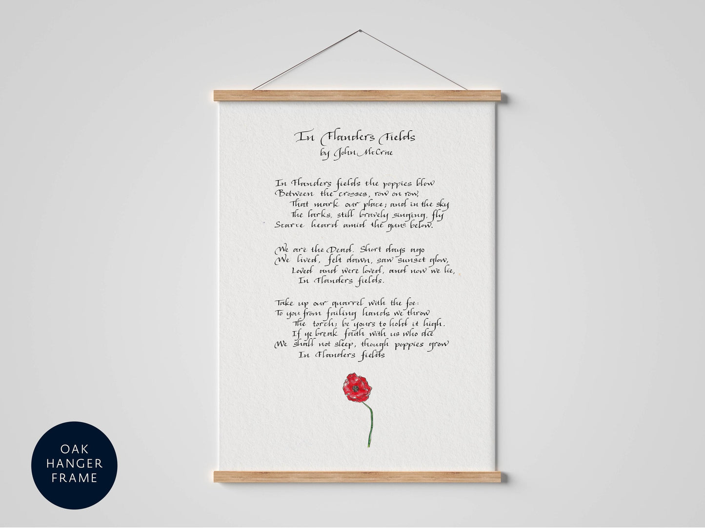 a framed poem titled &quot;In Flowers Fields&quot; by John McCrae.