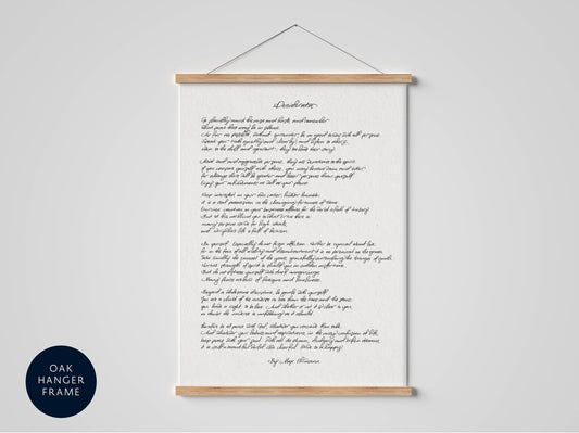a framed handwritten poem titled &quot;Desertion&quot; hanging on a wall.
