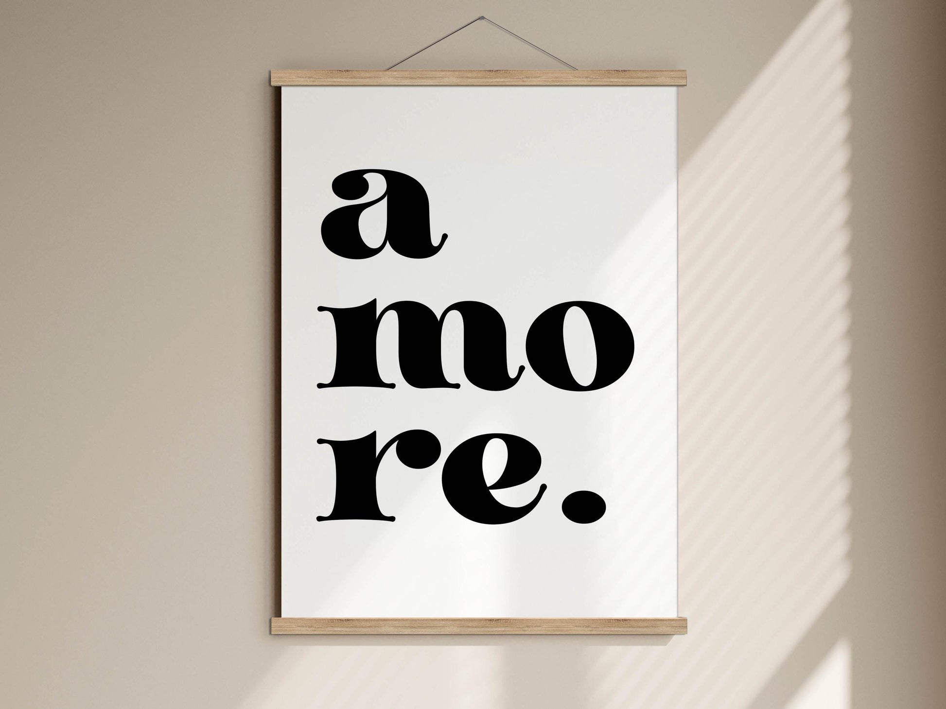 A white poster with the text &quot;a more&quot; in bold black letters.