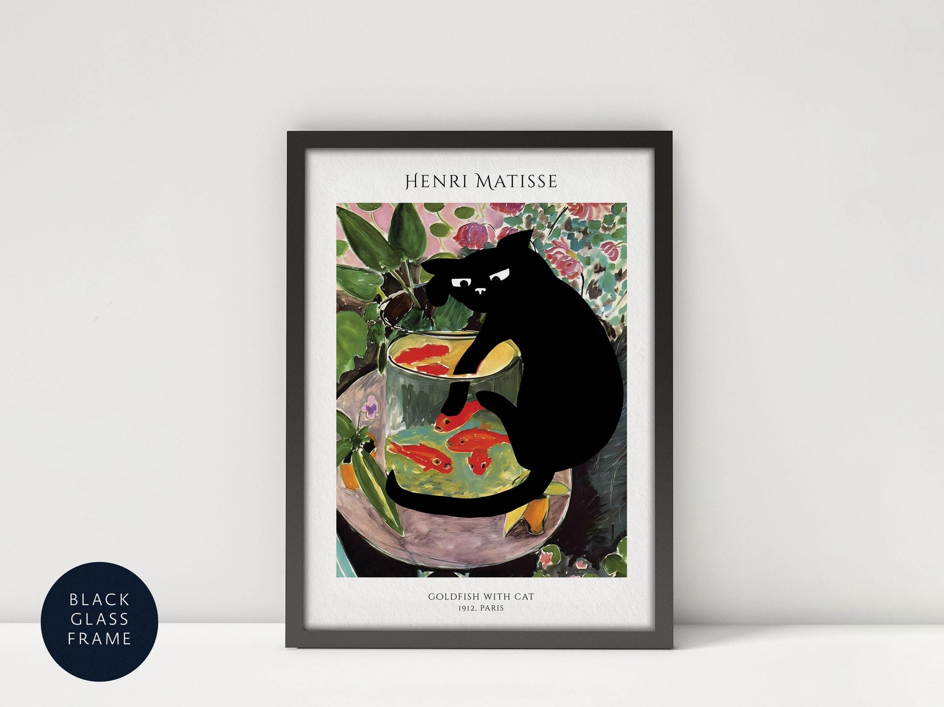 The image is a framed print of a painting by Henri Matisse, depicting a black cat sitting in a fishbowl filled with colorful fish.
