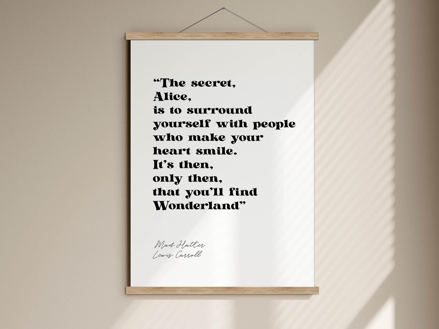 a quote from the book &quot;Alice in Wonderland&quot; by Lewis Carroll, which reads: &quot;The secret, Alice, is to surround yourself with people who make your heart smile. It&#39;s then, only then, that you&#39;ll find Wonderland&quot;.